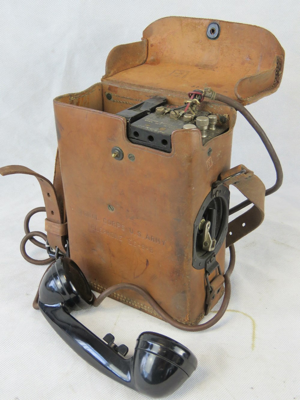 An American Military field telephone in case.