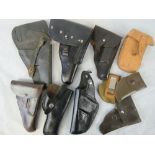 Ten assorted holsters including a WWII Colt 1911 holster.