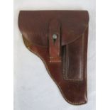 A WWII leather Walther PPK holster with Nazi marks to back.