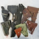 Ten assorted holsters including a Smith and Weston holster.