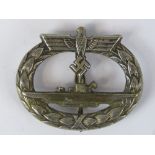 A WW2 Nazi German U-boat style metal badge; no markings verso; 5cm wide.