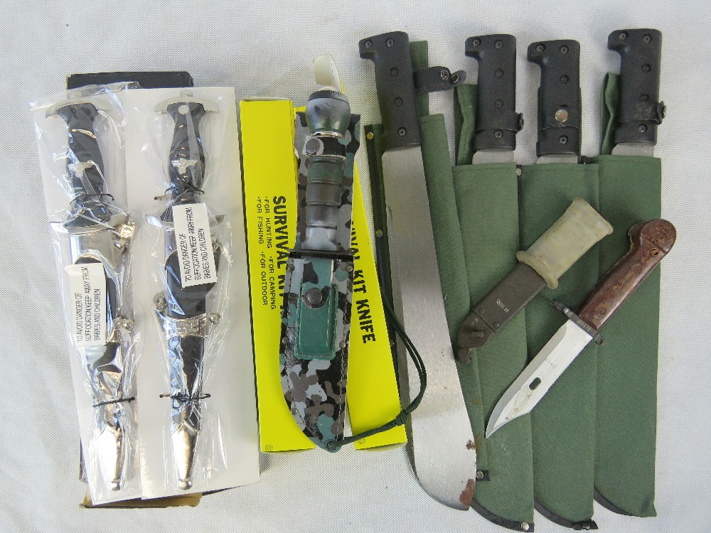 A selection of knives, survival and decorative.