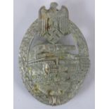 A reproduction WW2 Nazi German Wound badge in white metal; 6cm long.