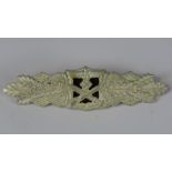 A reproduction WW2 Nazi German close combat badge (9.6cm wide).