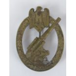 A Nazi Army Flak style badge; no markings verso; 6cm long.