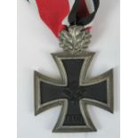 A WW2 Nazi Knight's Cross with oak leaves and ribbon, with no other markings.