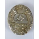 A reproduction WW2 Nazi Wound badge in white metal.