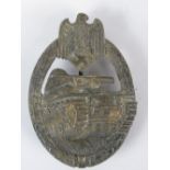 A reproduction bronzed Nazi Panzer Assault Badge; no markings verso; 6cm long.