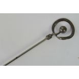 Charles Horner; a Sterling silver hat pin, ball and shaped hoop terminal, 16.5cm long.