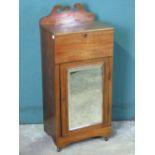 A late Victorian mahogany bedside pot stand having mirrored door and lidded compartment over 47cm