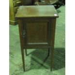 An Edwardian pot cupboard raised over square tapering legs