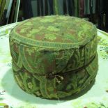 A vintage cloth pouffe, 45cm diameter. Provenance. From Saddington Hall, Leics.