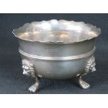 A heavy HM silver sugar bowl raised over three lions head and paw legs, London 1909, 7.41ozt.