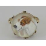 A 9ct gold painted reversed crystal intaglio Terrier ring made by Ernest.M. Pradier (1881-1967).