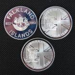 Three Falklands Islands silver coins, each weighing 28.28g. Total weight 84.84g.