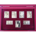 A cased set of seven silver-gilt replica stamps 'The Coronation Issue', 5.57ozt.