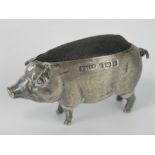 An Edwardian HM silver pin cushion in the form of a pig by Adie and Lovekin Ltd, Birmingham 1905, 4.