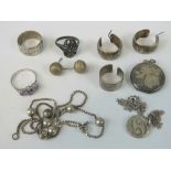 Silver jewellery; two rings, a pair of hoops a locket, necklace,