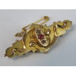 A 9ct gold ruby and diamond brooch,