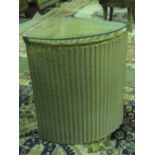 An original Lloyd Loom Lusty gold wicker and glass topped corner laundry bin.