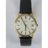 A 9ct gold vintage Omega watch c1970s, silvered dial, yellow metal batons, date aperture,