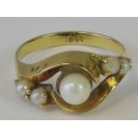 An 18ct gold and pearl ring,