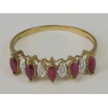 A 9ct gold ruby and diamond ring, five marquise cut rubies,
