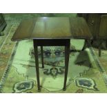 An Edwardian extending square shaped table raised over square shaped legs, 81cm extended.