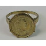 An Austrian 8ct gold 'coin' ring, a Maria Theresia 'coin' claw set in raised gallery,