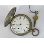 A silver full hunter key wind pocket watch with cylinder movement, ruby endstone,