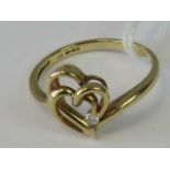 A 9ct gold diamond solitaire heart design ring,