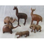 Three carved hardwood pachyderms, a leopard and two other animal wooden figures; a/f.