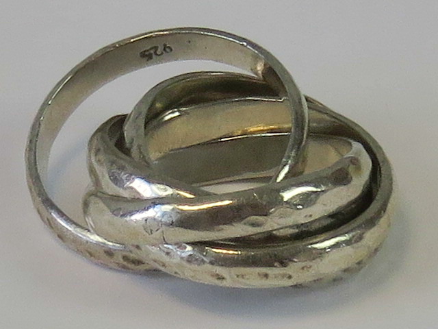 A silver Russian style interlocking bands ring, stamped 925, size L, 16g.