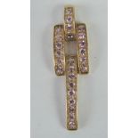 A 9ct gold pink sapphire pendant of geometric form, 1.022ct of pink sapphires, 3.