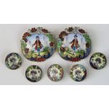 A set of seven enamelled buttons; two large buttons with gentleman in country scene, 32mm dia,