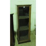 A tall rosewood glazed-door cabinet having shelves within. 45cm x 129.