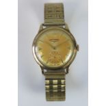 A 9ct gold Longines wristwatch on gold plated expanding bracelet,
