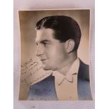 A signed publicity black and white photograph of celebrated 1940s singer, Donald Peers,