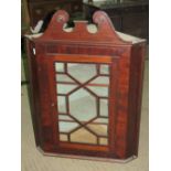 A Georgian style glazed door hanging corner cabinet.