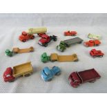 A collection of vintage, die-cast metal model trucks and vans, including models by Lesney,