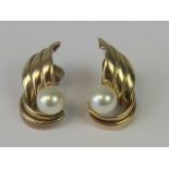 A pair of 9ct gold earrings, each set with a simulated pearl, hallmarked 375, 2cm in length, 2.5g.