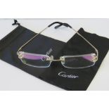 Cartier; a pair of 18ct gold mounted frameless glasses, numbered 3645631,