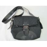 Gucci; a ladies handbag, black monogrammed fabric and black leather trim,