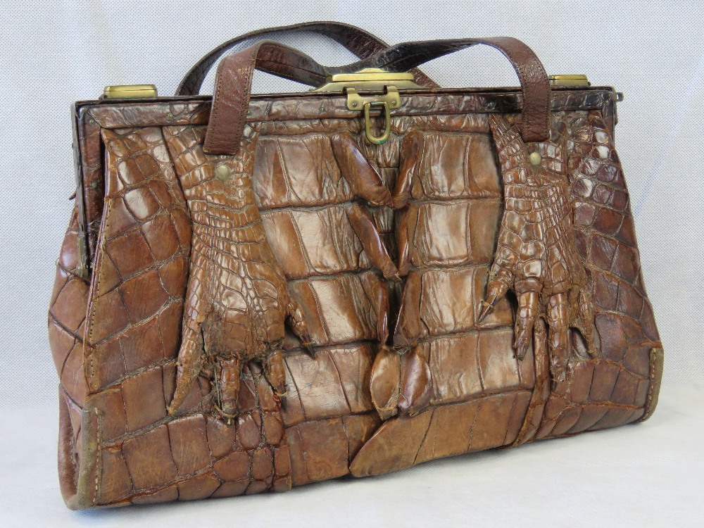 A vintage brown leather crocodile skin handbag having twin loop handles and brass fittings. - Image 2 of 2