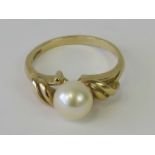 A 9ct gold and cultured pearl ring, hallmarked 375, size L-M, 2.