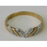 A 9ct white and gold band set with diamond chips, hallmarked 375, size Q-R, 2.