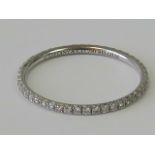 A Tiffany 18ct white gold and diamond eternity ring,