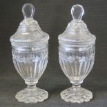 A good pair of Georgian style glass lidded bonbon jars each 20cm high.