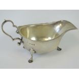 A HM silver sauce boat with pie crust edge and three feet, Birmingham 1912 - A & J Zimmerman Ltd, 3.