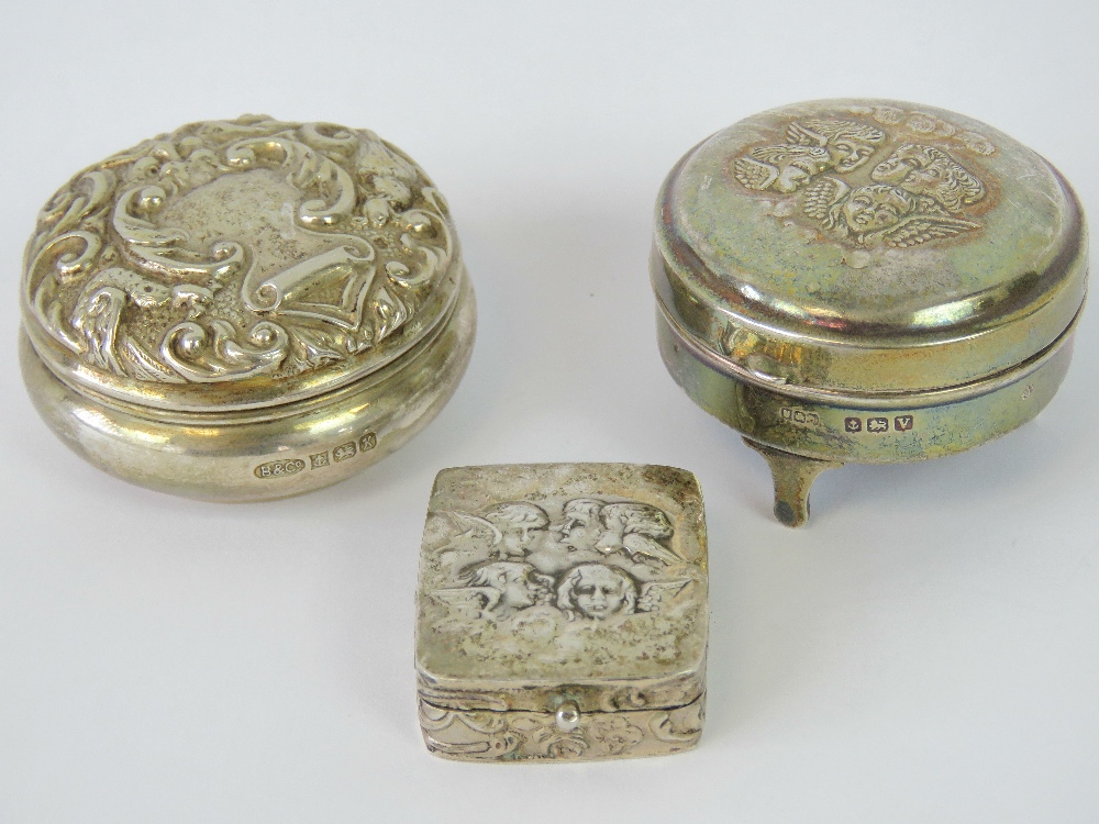 Three HM silver ladies dressing table pots; one with three feet,